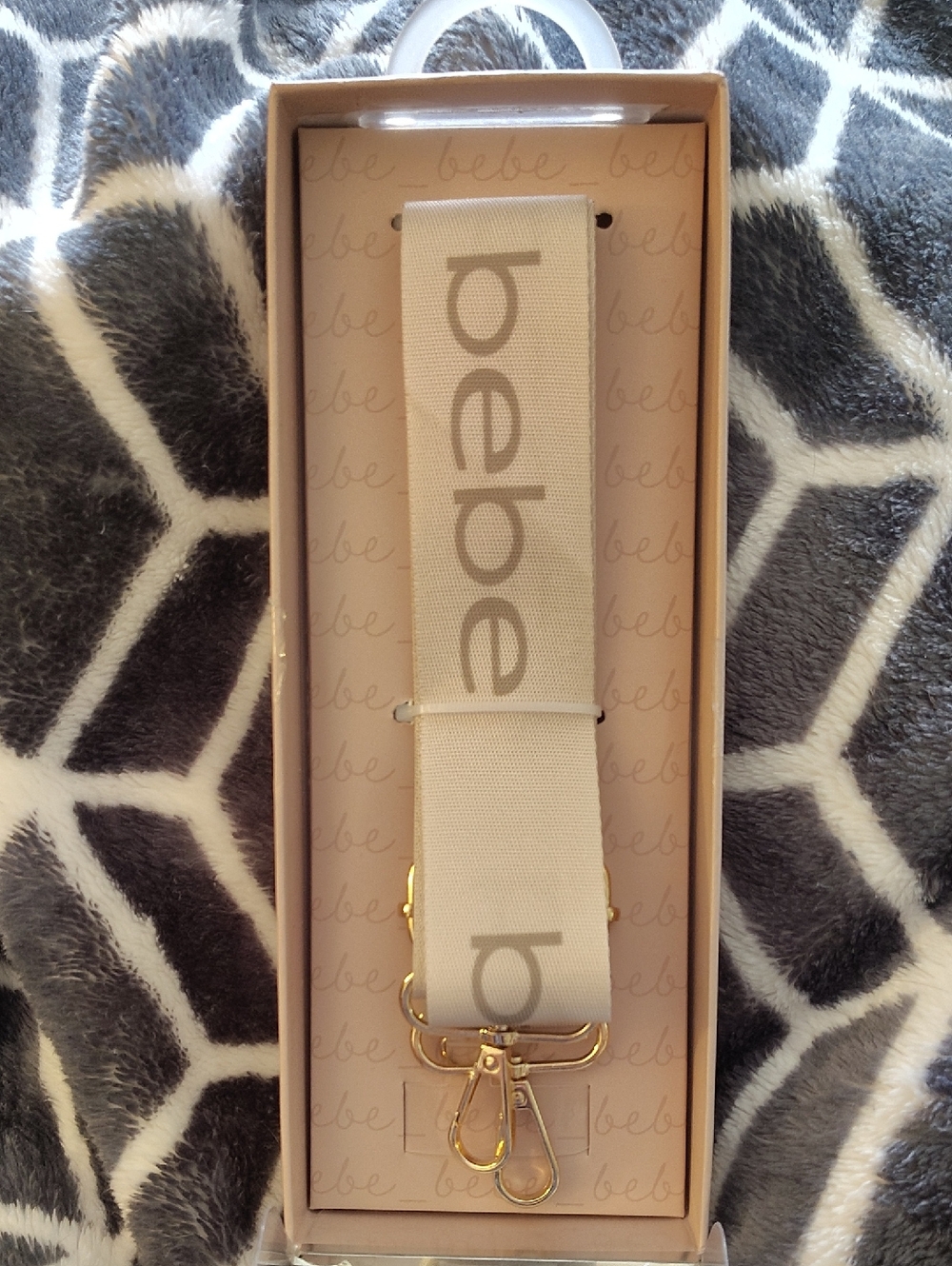 bebe Beige Logo Adjustable Bag Or Cell Strap with Gold Hardware